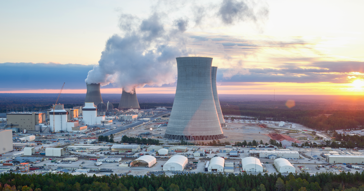A nuclear power plant with smoke coming out of it

AI-generated content may be incorrect.