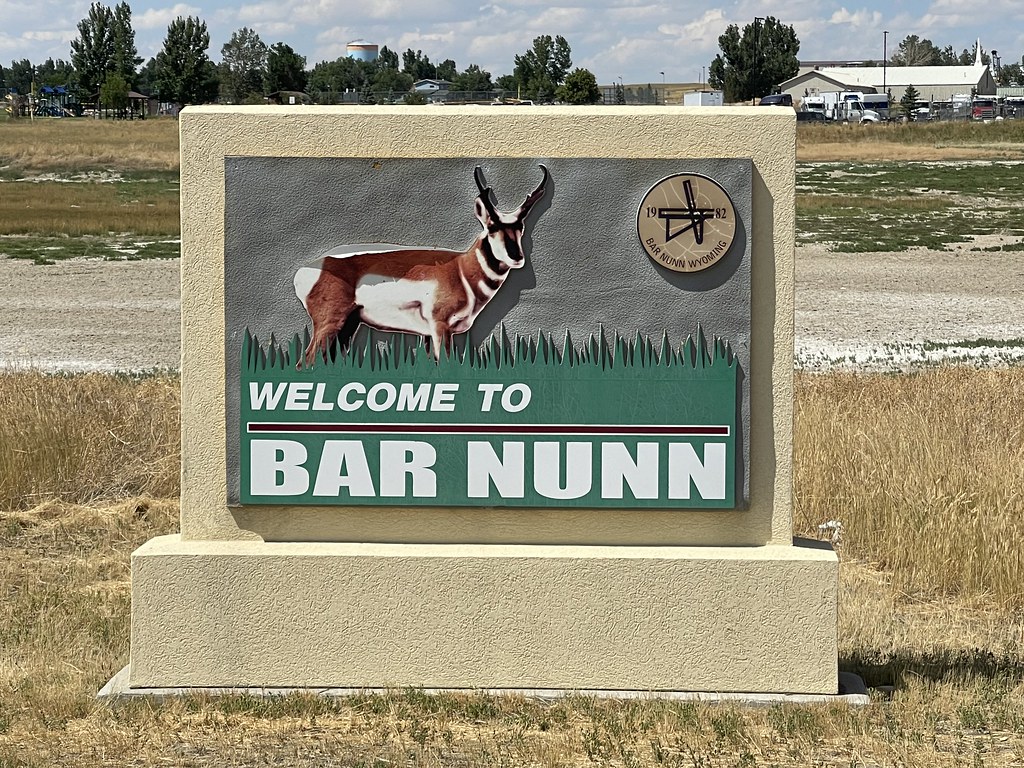 A sign in a field

AI-generated content may be incorrect.